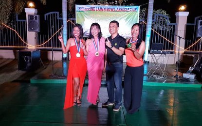 <p>(L-R) Ainie Knight, Asuncion Bruce, Philippine Lawn Bowls Association president Rosever Dabi Pascua and Ronalyn Greenlees during the awarding ceremony of the PLBA National Triples Championship held last February at the Angeles Sports and Country Club in Angeles City, Pampanga. <em>(Photo courtesy of Ronalyn Greenlees)</em></p>